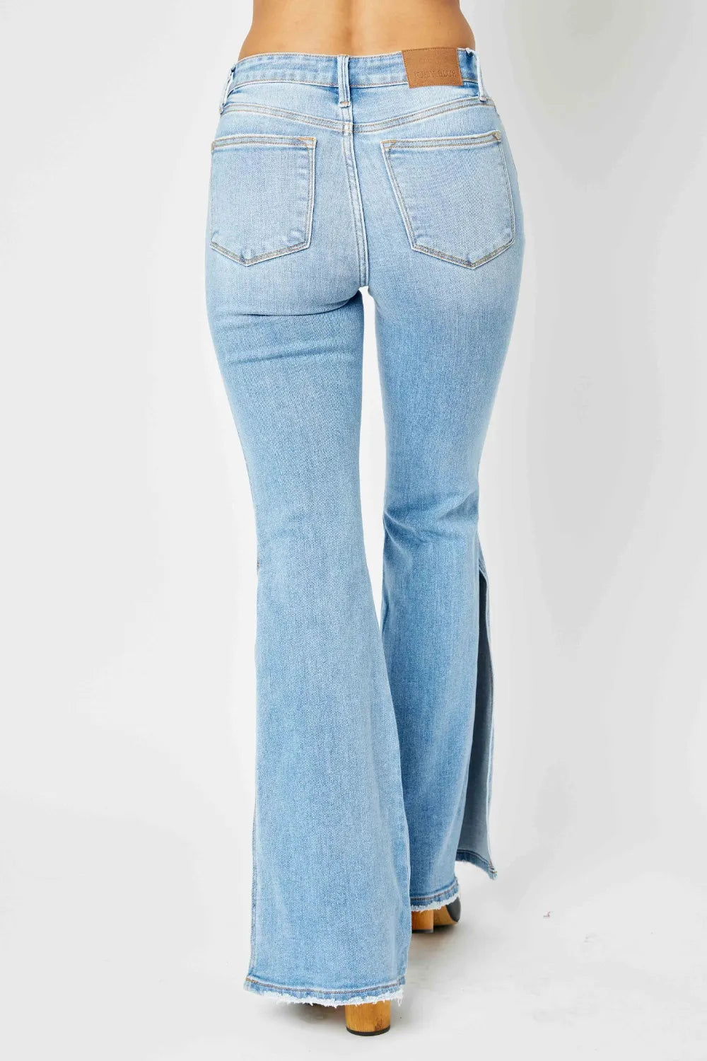 Judy Blue Full Size Mid Rise Raw Hem Slit Flare Jeans - WYNFLARE