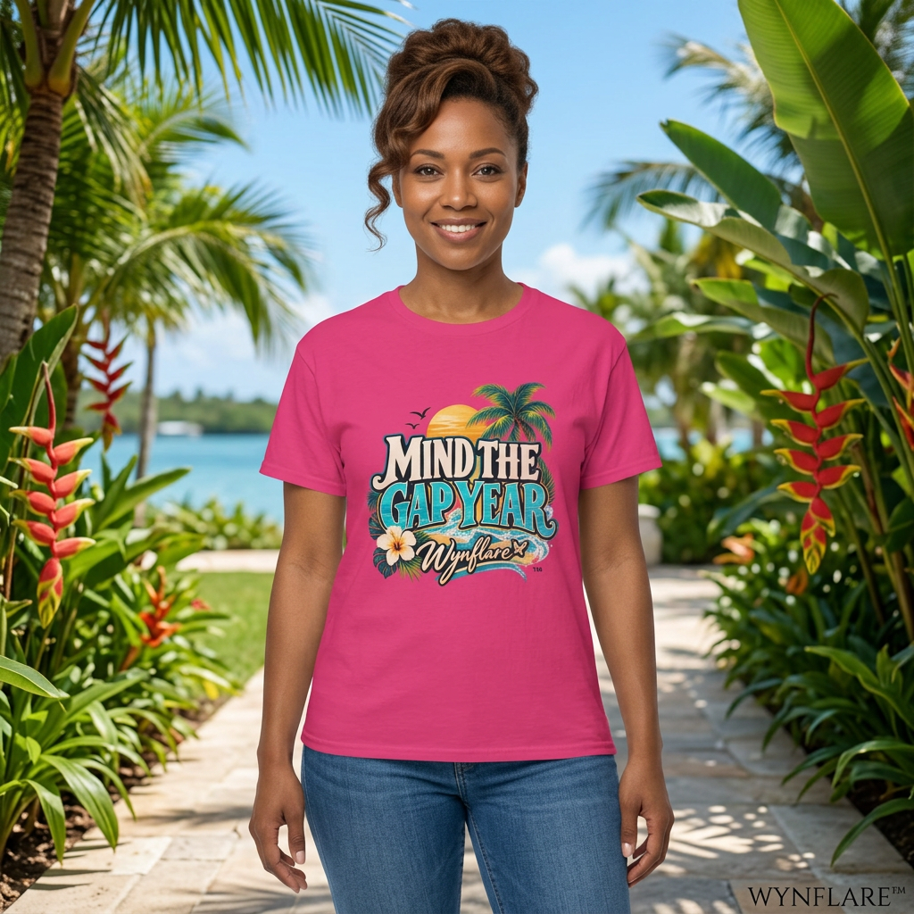 Woman wearing the heliconia pink Wynflare Mind the Gap Year graphic tee on a sunny tropical walkway